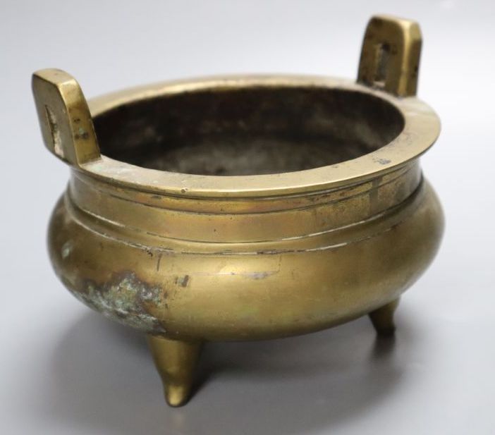 A Chinese two handled bronze censer, 16cm diameter
